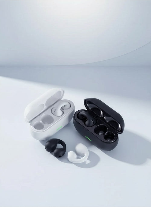 Evo Earbuds clip-on open-ear headphones in black and white with matching charging cases on a light background.